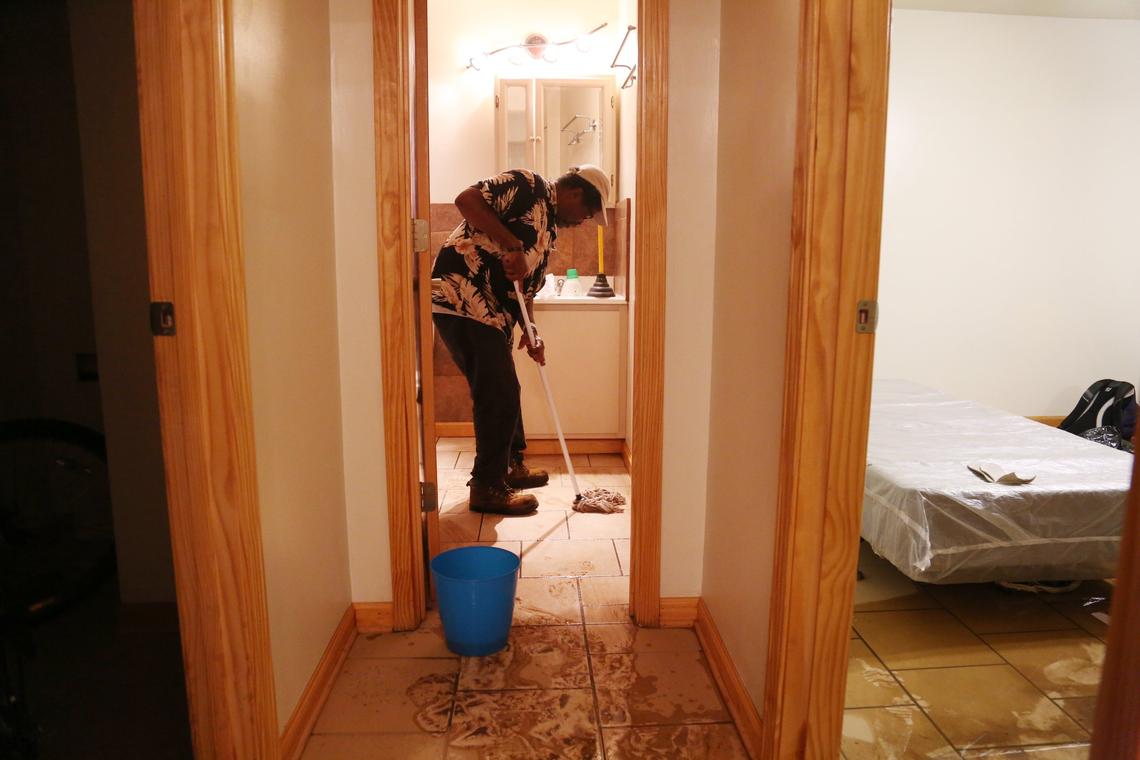 After finishing up his job as a cleaner in Carrboro, Vincent Baldwin returns to his flooded apartment at Camelot Village Condominiums off of Estes Drive in Chapel Hill on Tuesday, Sept. 18, 2018.  Baldwin, who has lived in the apartment for a year, was at work when his apartment flooded yesterday morning.