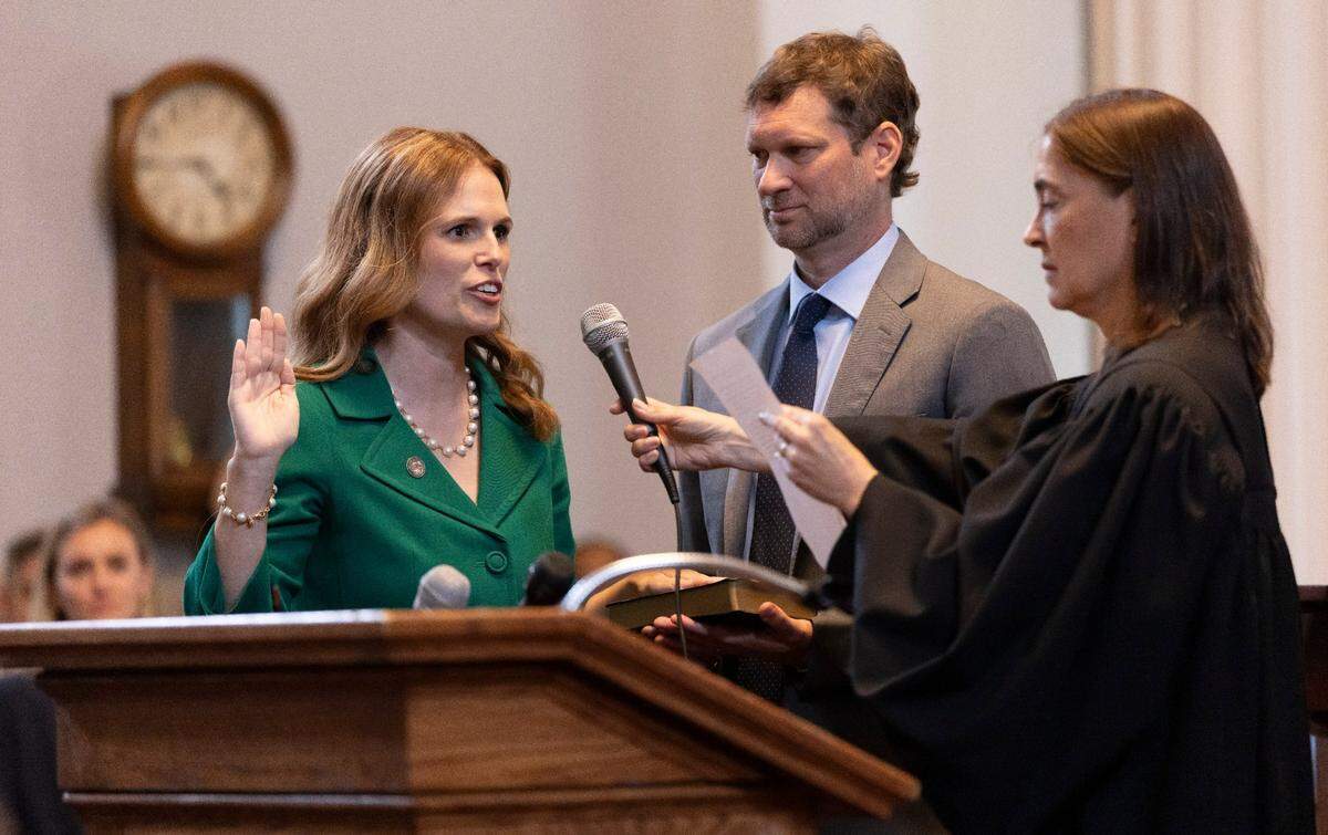 Justice Allison Riggs takes the oath of office for the North Carolina Supreme Court from Justice Anita Earls in the State Capitol on Tuesday, May 13, 2025 in Raleigh, N.C. Riggs was certified the winner of her race against Judge Jefferson Griffin after a more than six-month challenge by Griffin and the Republican Party.