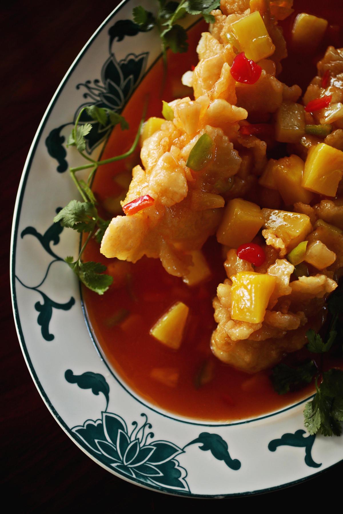 The star of the show at Acacia Tree in Morrisville is sweet sour fish, which turns out to be their rendition of a dish also known by the fanciful name of squirrel fish. The dish features flounder filet, cut in a crosshatch pattern so that it fans out when fried, then glazed with a pineapple- and red pepper-spangled sweet and sour sauce.