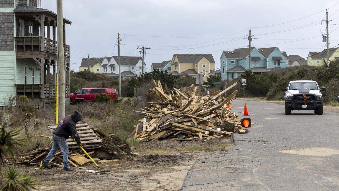 Debris from beach homes that collapsed into the Atlantic Ocean is piled along Old Lighthouse Road for removal on Friday, Oct. 10, 2025, in Buxton as a nor’easter approaches the North Carolina coast. Nine homes in Buxton have fallen into the ocean since mid-September.