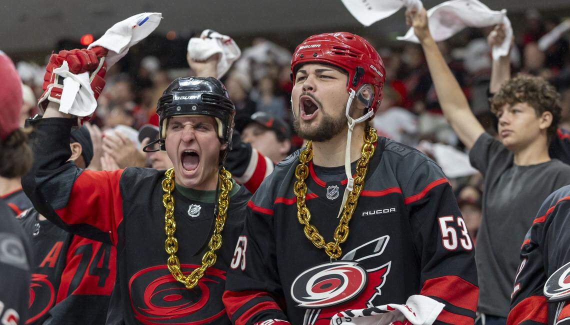 Carolina Hurricanes fans Jason Walorz and Nicholas Torri react after a fight by Jordan Staal (11) in the first period against Ottawa on Saturday, April 18, 2026 during the first round of the Stanley Cup Playoffs at Lenovo Center in Raleigh, N.C. 
