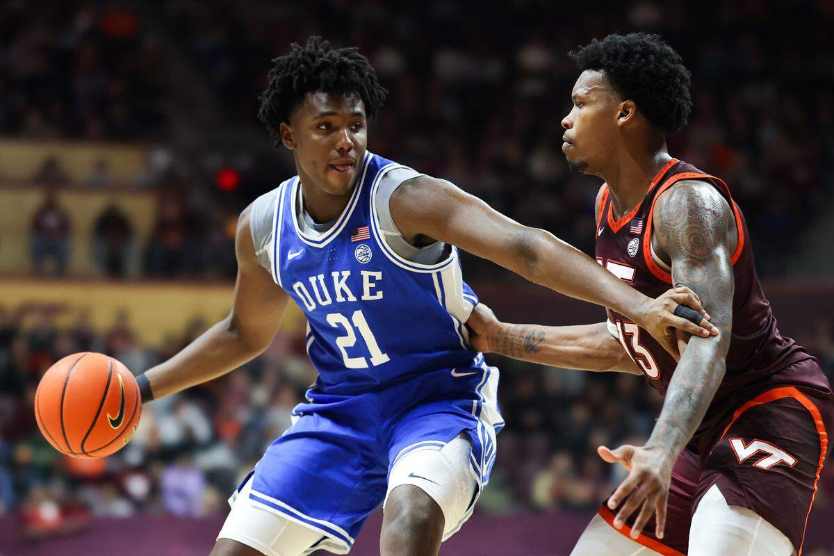 Patrick Ngongba II (21) of the Duke Blue Devils drives against Amani Hansberry (13) of the Virginia Tech Hokies in the second half during a game at Cassell Coliseum on January 31, 2026 in Blacksburg, Virginia.  