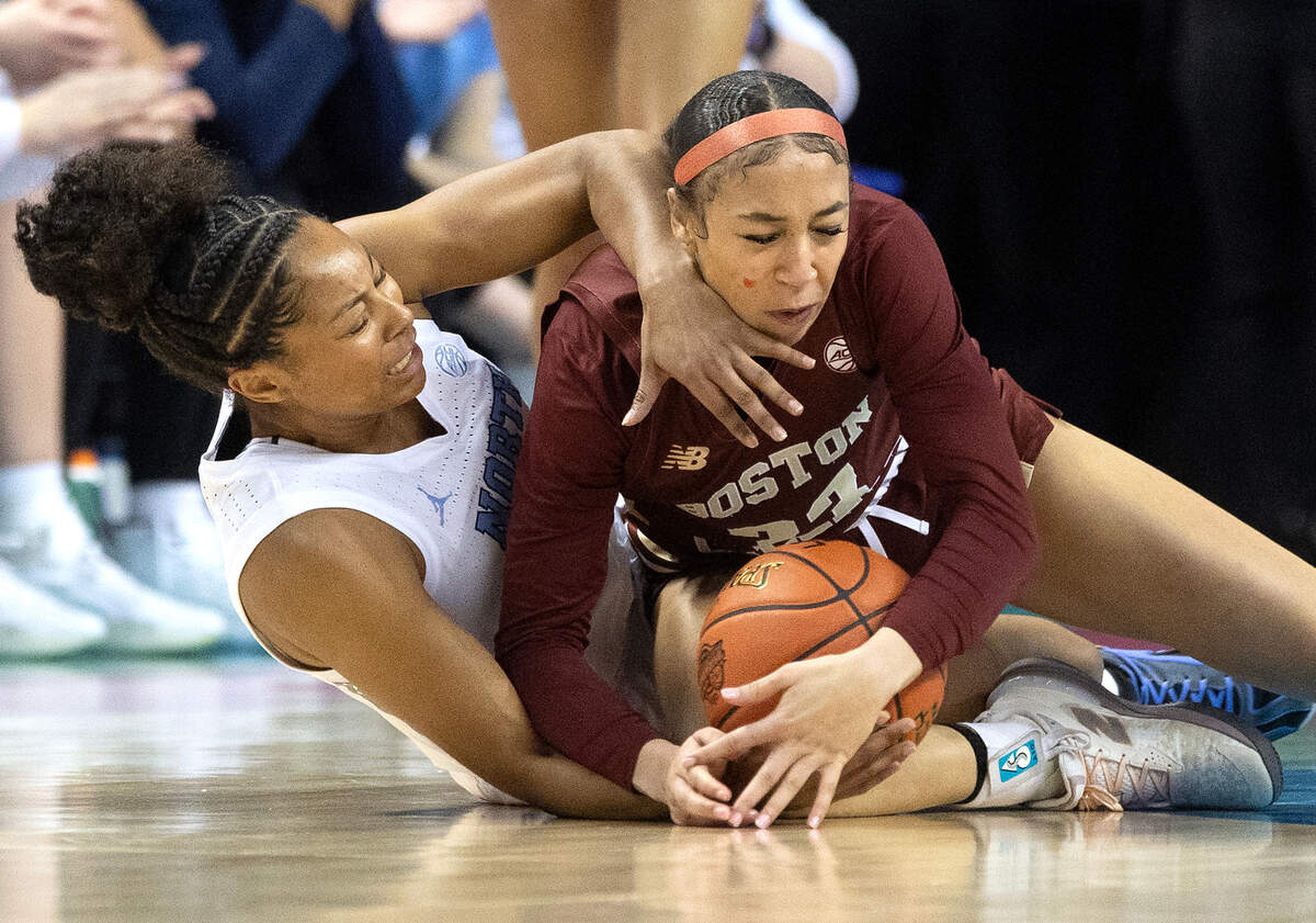 North Carolina’s Indya Nivar and Boston College’s Savannah Samuel dive on the floor for a loose ball during the first half of the Tar Heels’ ACC Tournament game on Thursday, March 6, 2025, at First Horizon Coliseum in Greensboro, N.C.