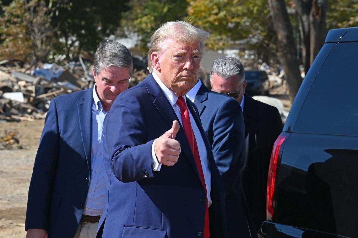 Former President Donald J. Trump gives a thumbs up after speaking to the media with local Swannanoa, NC officials on Monday, October 21, 2024. The former president toured damage in the local area caused by Hurricane Helene.