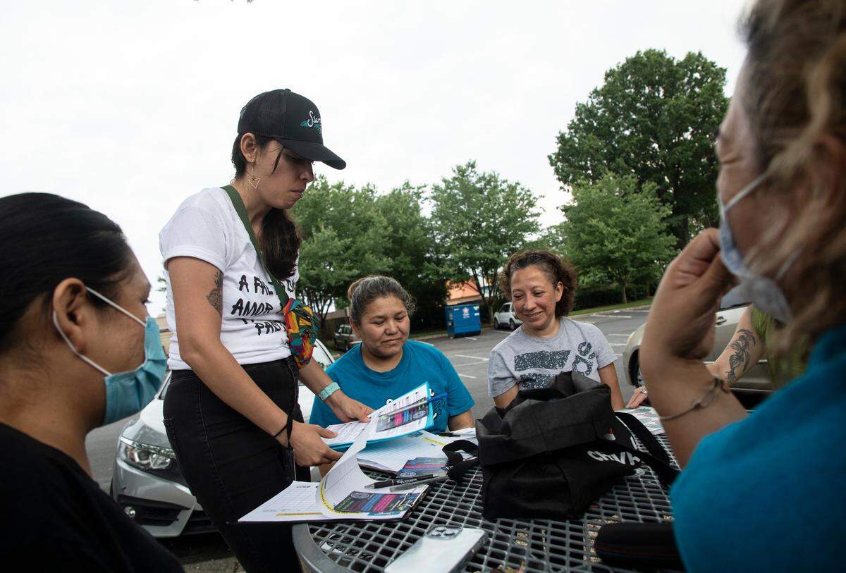 Laura Garduño-García, who works as a community organizer, leads voter registration training for members of Siembra NC on Thursday, May 26, 2022, in Greensboro, N.C.
