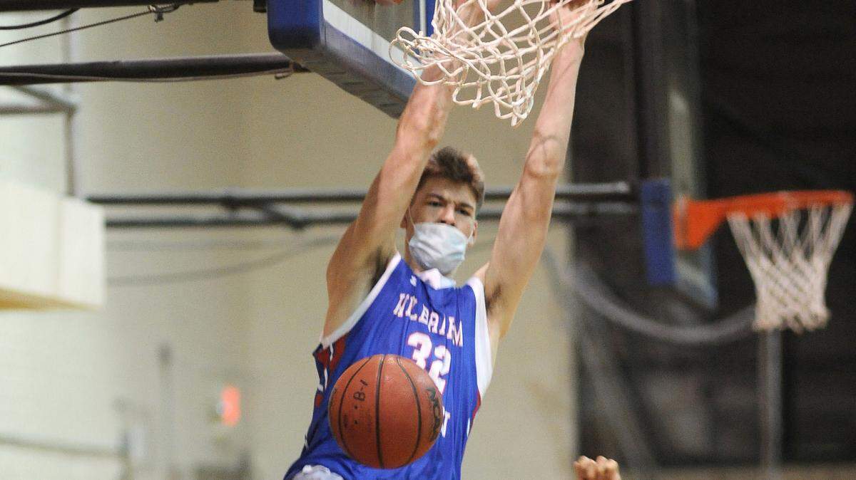 Wilbraham & Monson Academy’s Kyle Filipowski slams in two during a game last season. Filipowski has signed with Duke.