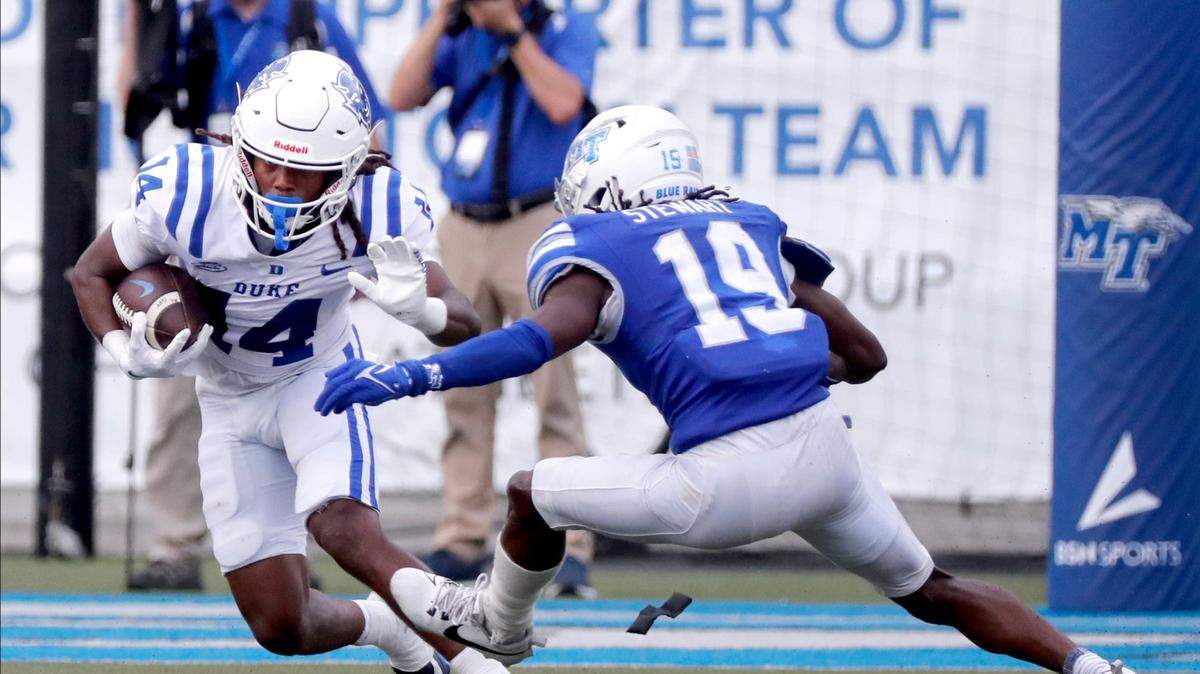 Duke wide receiver Que’Sean Brown (14) carries the ball as Middle Tennessee wide receiver Kellen Stewart (19) moves in for a tackle on Saturday, Sept. 21, 2024.