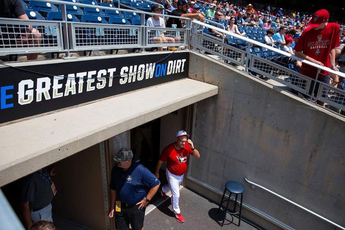 North Carolina State head Coach Elliott Avent exits the locker room during a delay due to COVID-19 safety protocols before their baseball game against Vanderbilt at the College World Series Friday, June 25, 2021, at TD Ameritrade Park in Omaha.