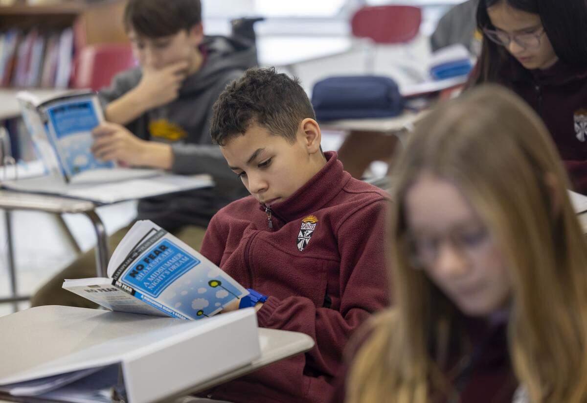 Yonaibert Silva, a seventh grader at St. Catherine of Siena Catholic School, reads in his English Language Arts class in February 2026 in Wake Forest. File photo.