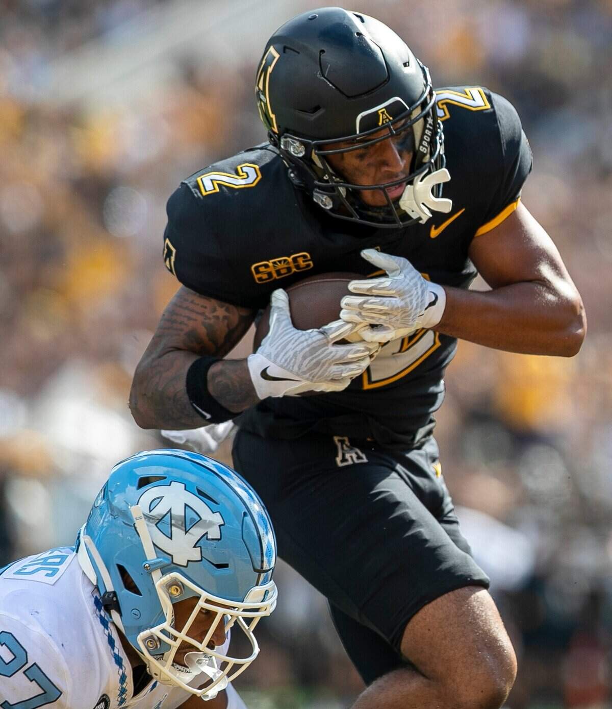 Appalachian State’s Kaedin Robinson (2) scores a touchdown on a 26-yard pass from quarterback Chase Brice with :09 seconds to play in the game on Saturday, September 3, 2022 at Kidd Brewer Stadium in Boone, N.C.