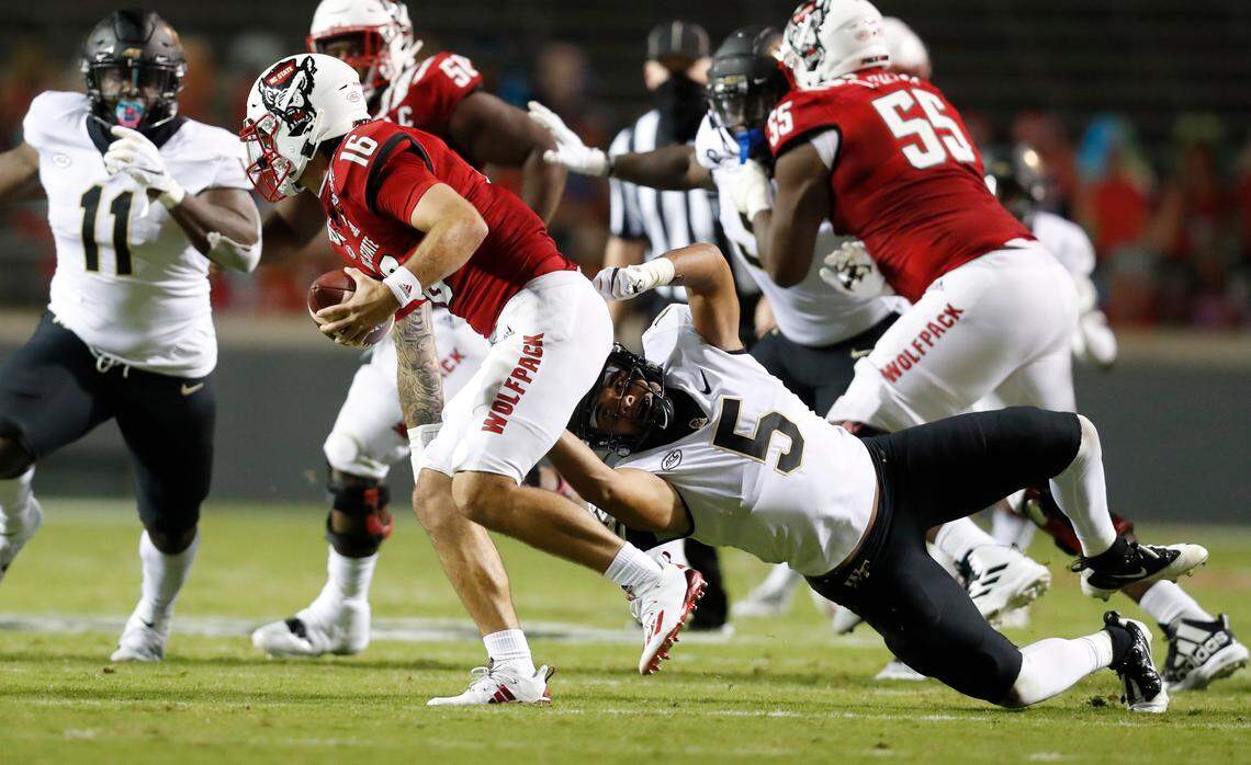 Wake Forest linebacker Ryan Smenda Jr. (5) pressures N.C. State quarterback Bailey Hockman (16) during the first half of N.C. State’s game against Wake Forest at Carter-Finley Stadium in Raleigh, N.C, Saturday, Sept. 19, 2020.