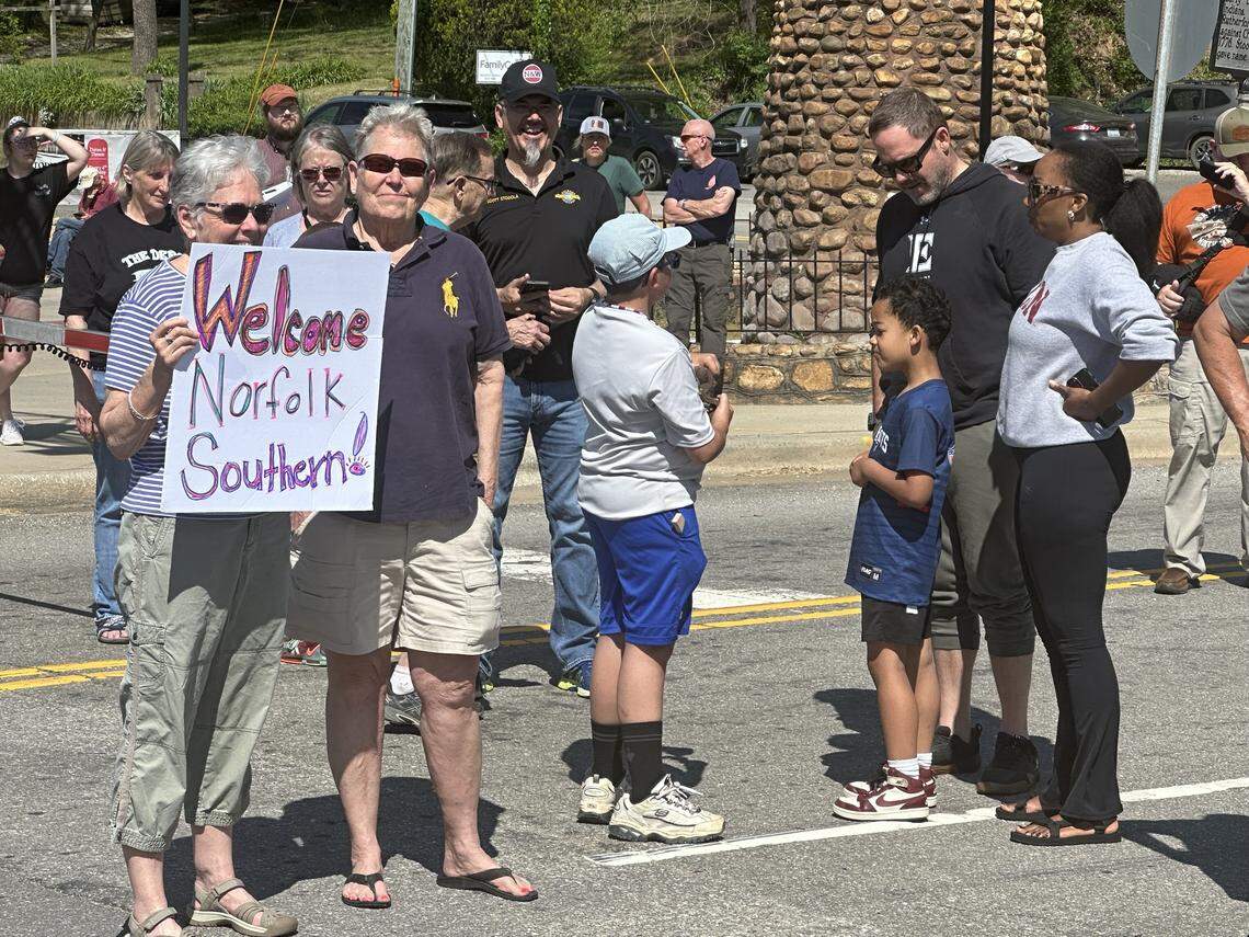 Deb Vingle, left, and Margaret Levings of Black Mountain made a homemade sign to welcome Norfolk Southern trains back to Old Fort on Saturday, April 18, 2026.