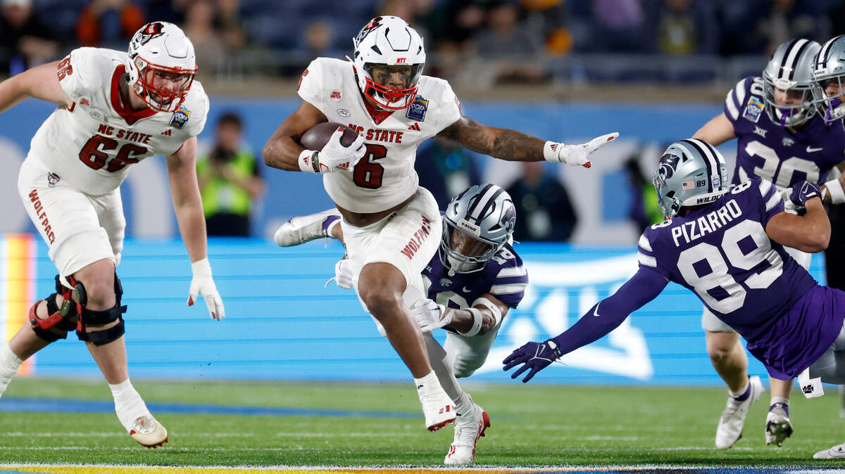 N.C. State’s Trent Pennix (6) breaks free to score on a 60-yard fake punt during the second half of Kansas State’s 28-19 victory over N.C. State in the Pop-Tarts Bowl at Camping World Stadium in Orlando, Fla., Thursday, Dec. 28, 2023.
