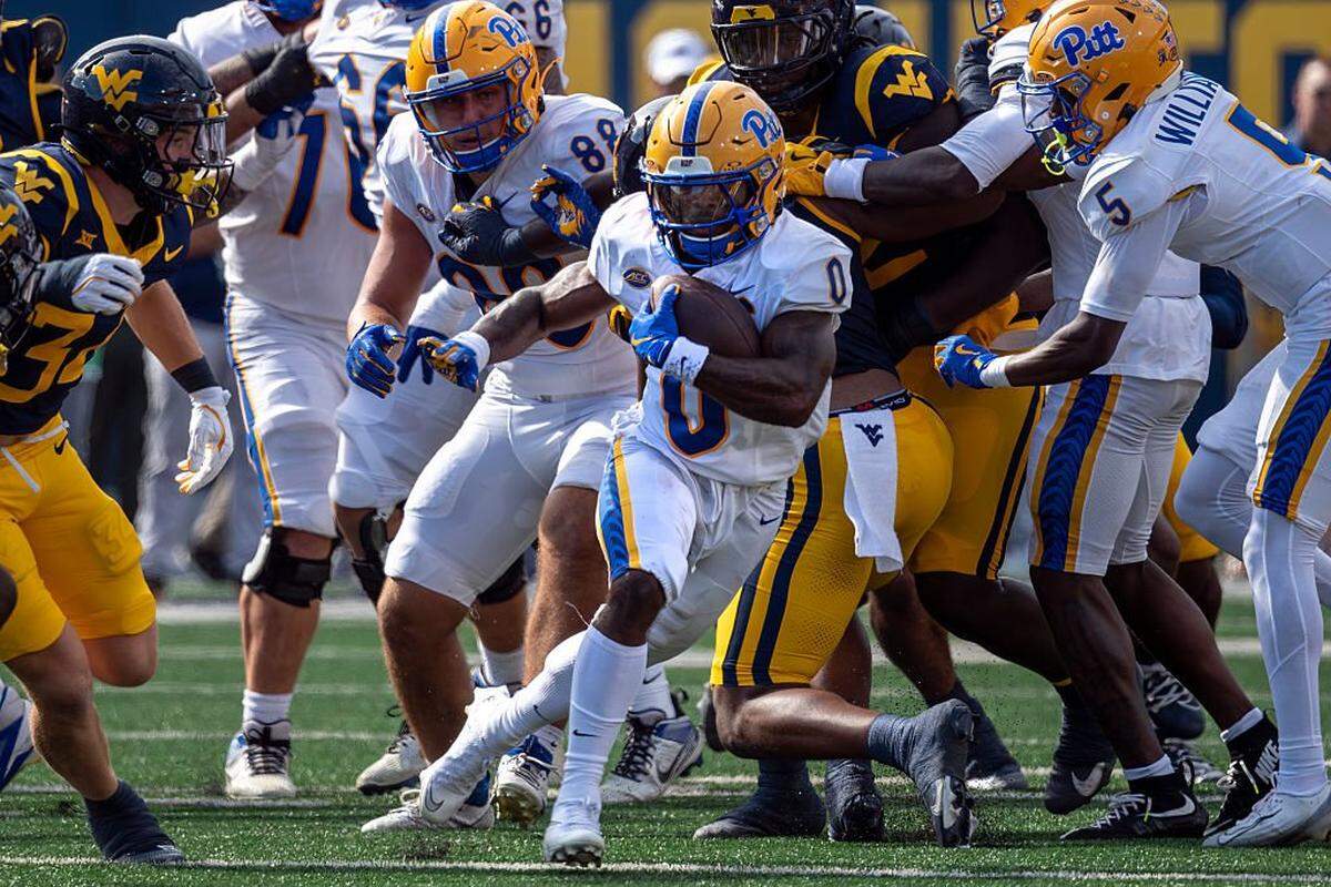 Desmond Reid (0) of the Pittsburgh Panthers in action first quarter of a game against West Virginia Mountaineers at Milan Puskar Stadium on September 13, 2025 in Morgantown, West Virginia.