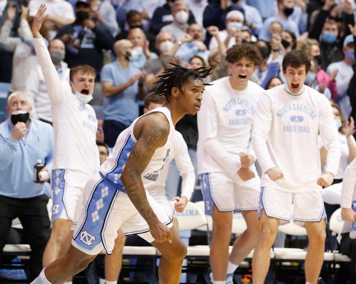 North Carolina’s Caleb Love (2) runs back downcourt after making a layup to put the Tar Heels’ up 68-63 with 37 seconds left in the game during UNC’s 70-63 victory over Louisville at the Smith Center in Chapel Hill, N.C., Monday, Feb. 21, 2022.