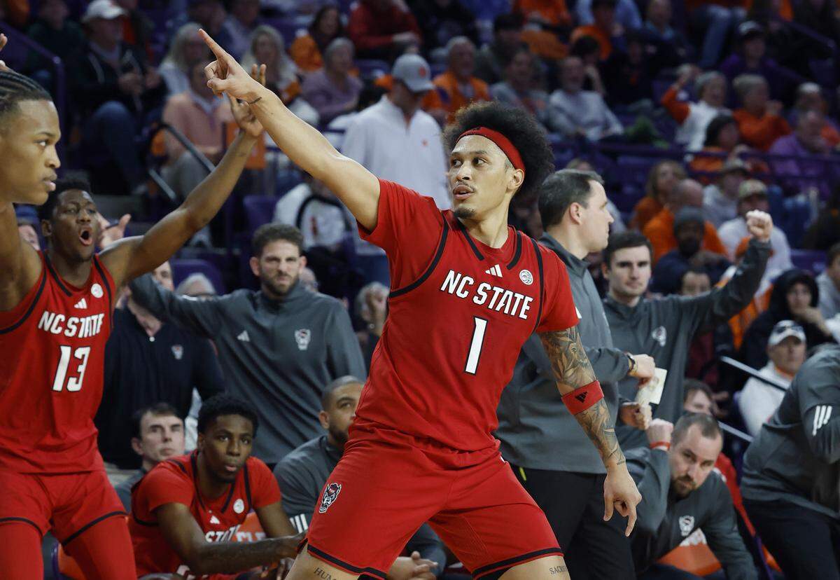 N.C. State's Darrion Williams (1) celebrates after hitting a three-pointer in overtime during N.C. State’s 80-76 overtime victory over Clemson at Littlejohn Coliseum in Clemson, S.C., Tuesday, Jan. 20, 2026.
