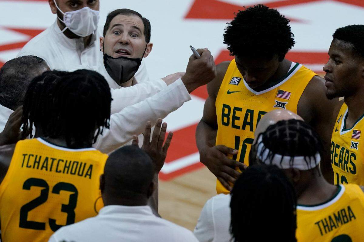 Baylor head coach Scott Drew talks to his team against Oklahoma State in the semifinals of the Big 12 tournament in Kansas City, Mo., Friday, March 12, 2021.
