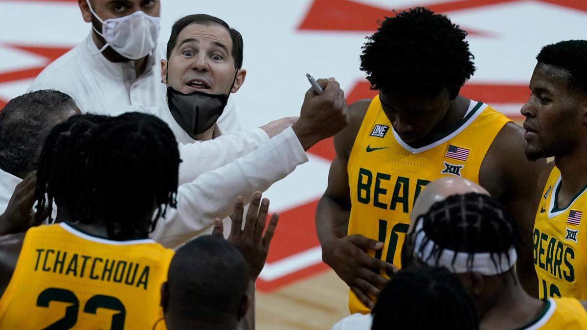 Baylor head coach Scott Drew talks to his team against Oklahoma State in the semifinals of the Big 12 tournament in Kansas City, Mo., Friday, March 12, 2021.