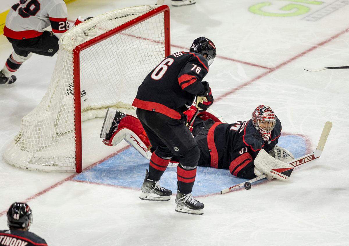 The Carolina Hurricanes goalie Frederik Andersen (31) stops a scoring attempt by the Ottawa Senators Drake Batherson (19) in the second period on Wednesday, October 11, 2023 at PNC Arena, in Raleigh N.C.
