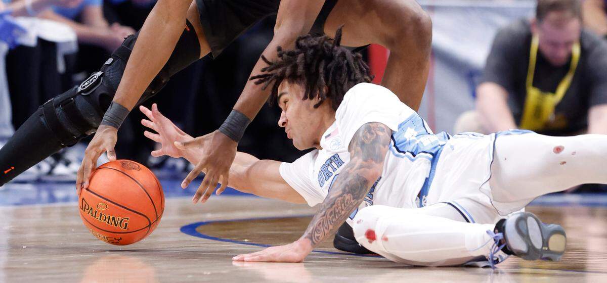 North Carolina’s Elliot Cadeau (2) steals the ball from Florida State’s Jaylan Gainey (33) during the first half of UNC’s game against Florida State in the quarterfinal round of the 2024 ACC Men’s Basketball Tournament at Capital One Arena in Washington, D.C., Thursday, March 14, 2024.