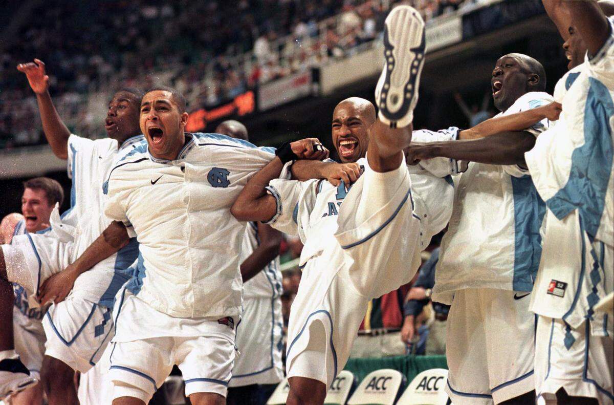UNC’s bench reacts to substitutes scoring late in the game against NC State.