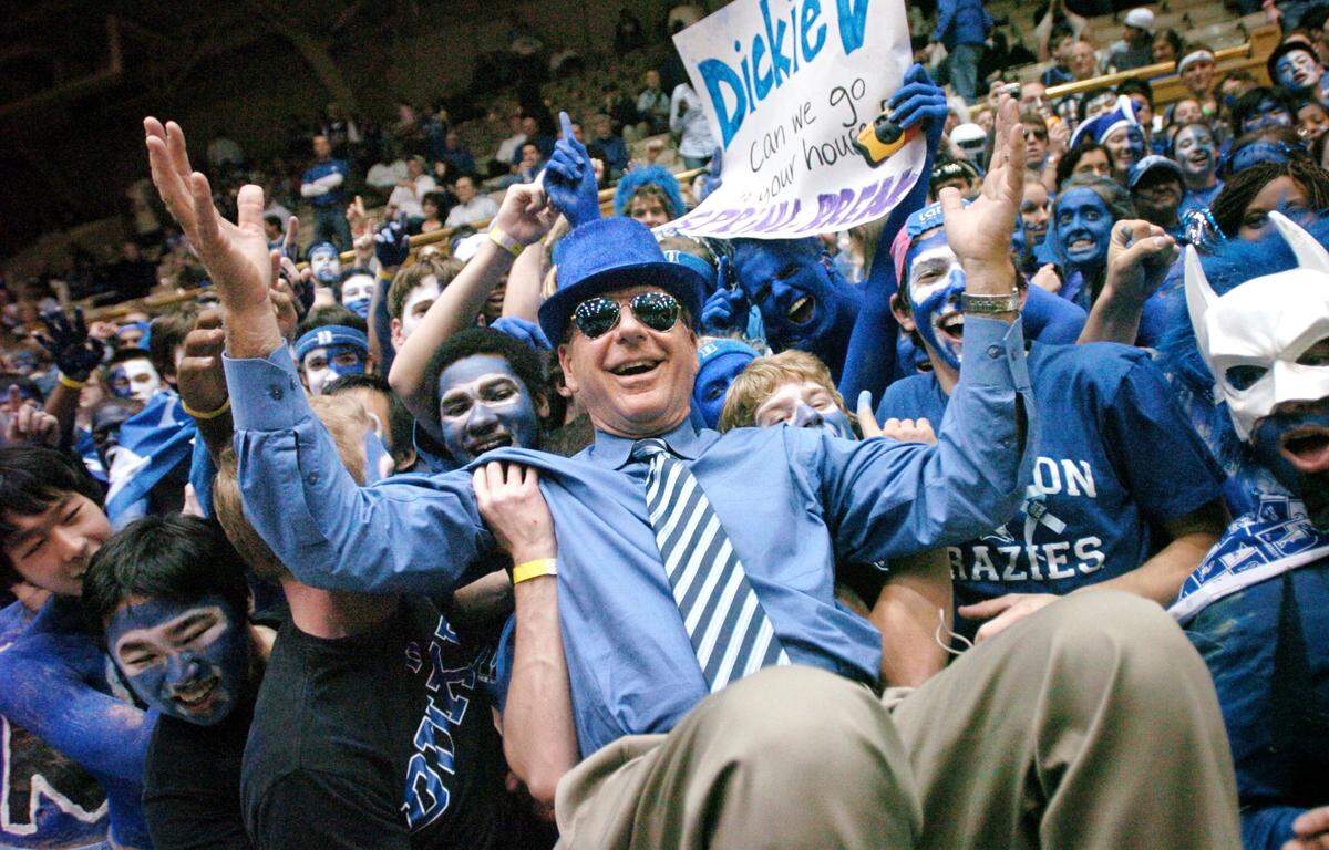 ESPN announcer Dick Vitale poses with the Cameron Crazies before the Blue Devils game against UNC in March 2008.