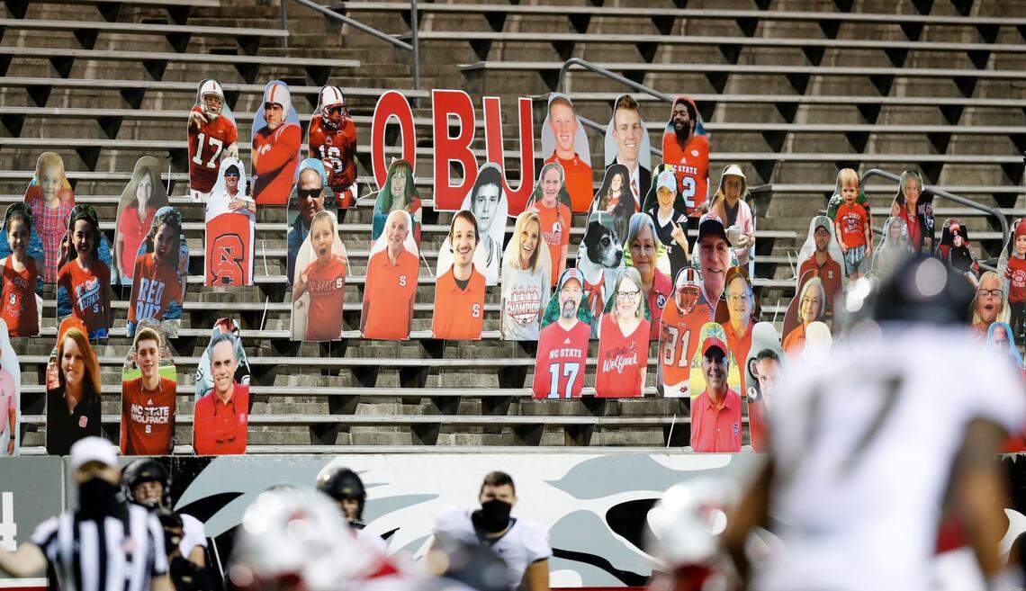 Cutout fans, including the Wolfpack quarterbacks who have played in NFL, watch during the second half of N.C. State’s 45-42 victory over Wake Forest at Carter-Finley Stadium in Raleigh, N.C, Saturday, Sept. 19, 2020.