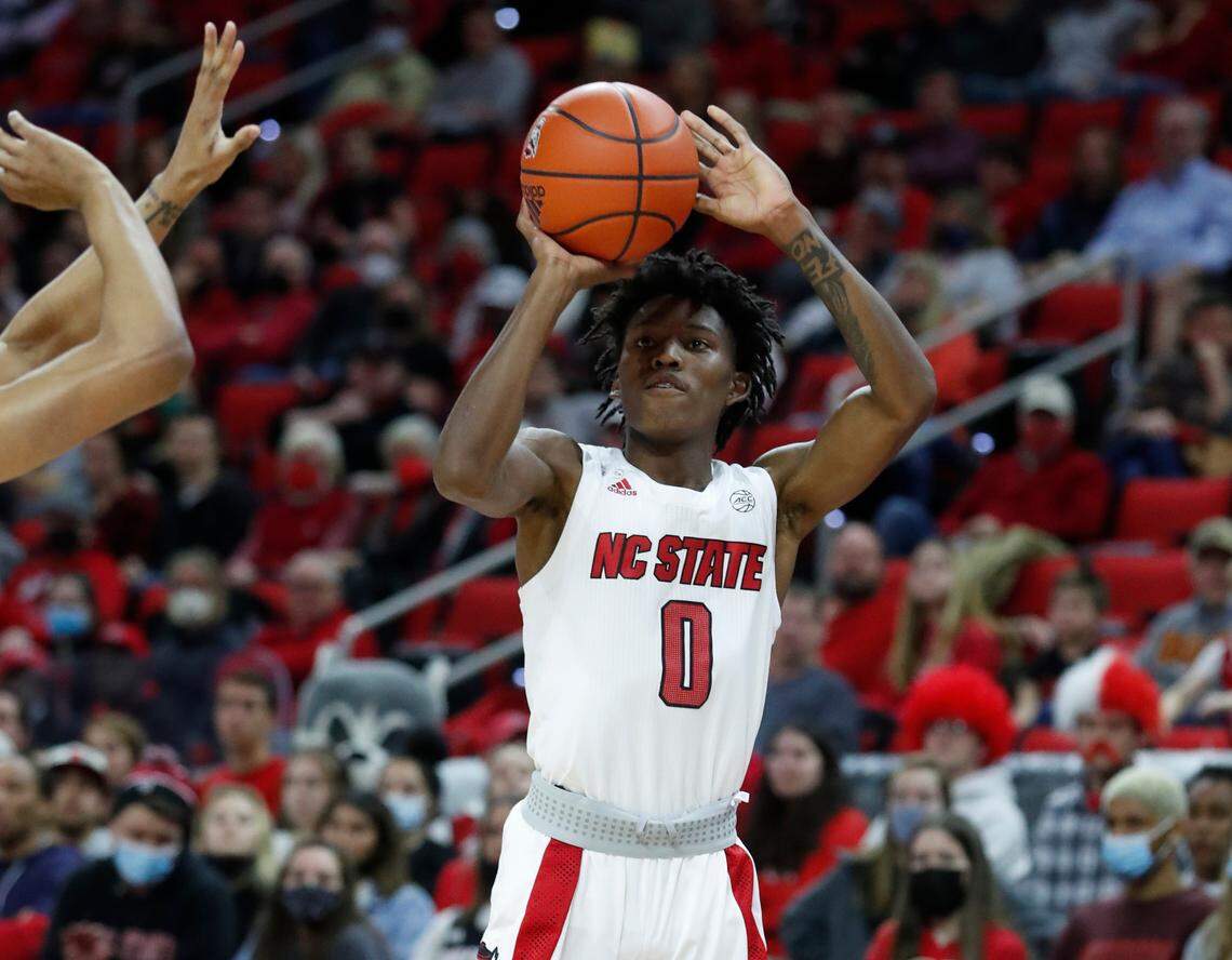 N.C. State’s Terquavion Smith (0) shoots during the first half of N.C. State’s game against Virginia Tech at PNC Arena in Raleigh, N.C., Wednesday, Jan. 19, 2022.