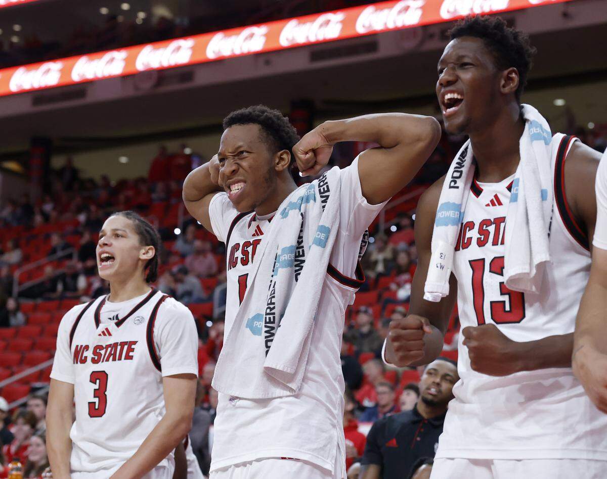 N.C. State’s Quadir Copeland, center, reacts on the bench late in the second half of the Wolfpack’s 85-45 win over Liberty on Wednesday, Dec. 10, 2025, at Lenovo Center in Raleigh, N.C. 