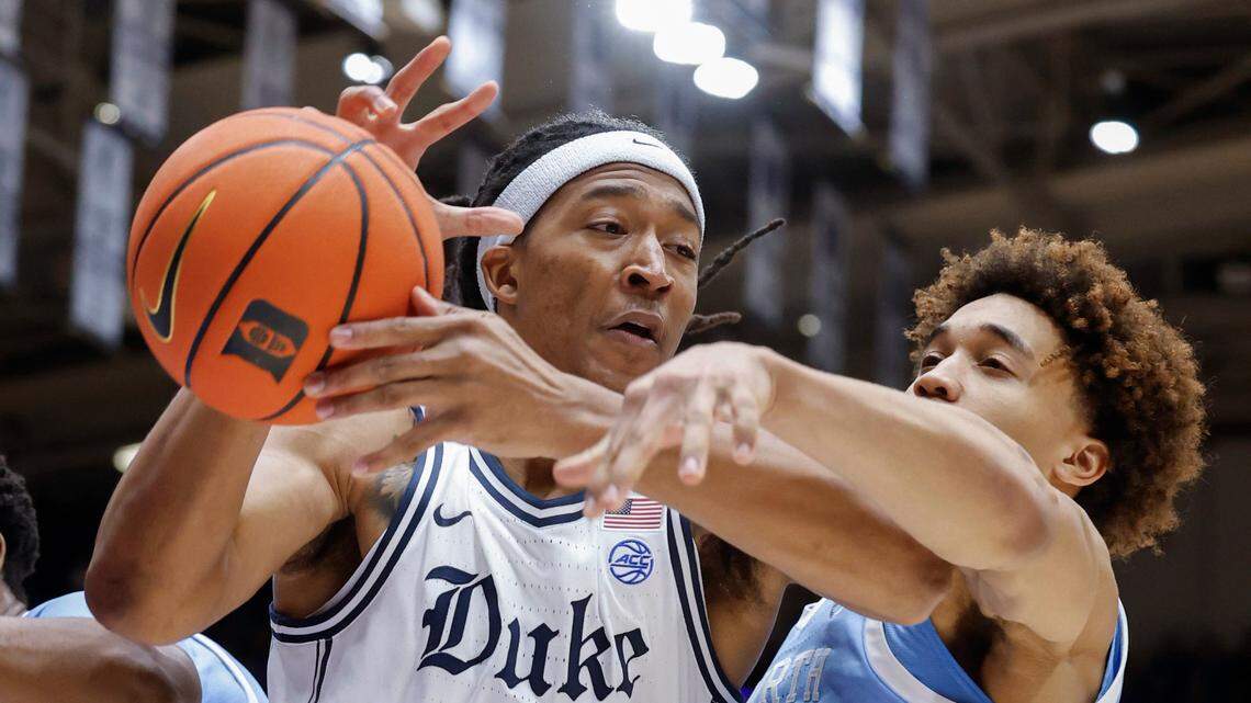 Duke’s Maliq Brown (6) pulls in the rebound from North Carolina’s Seth Trimble (7) during the first half of Duke’s game against UNC at Cameron Indoor Stadium in Durham, N.C., Saturday, Feb. 1, 2025.