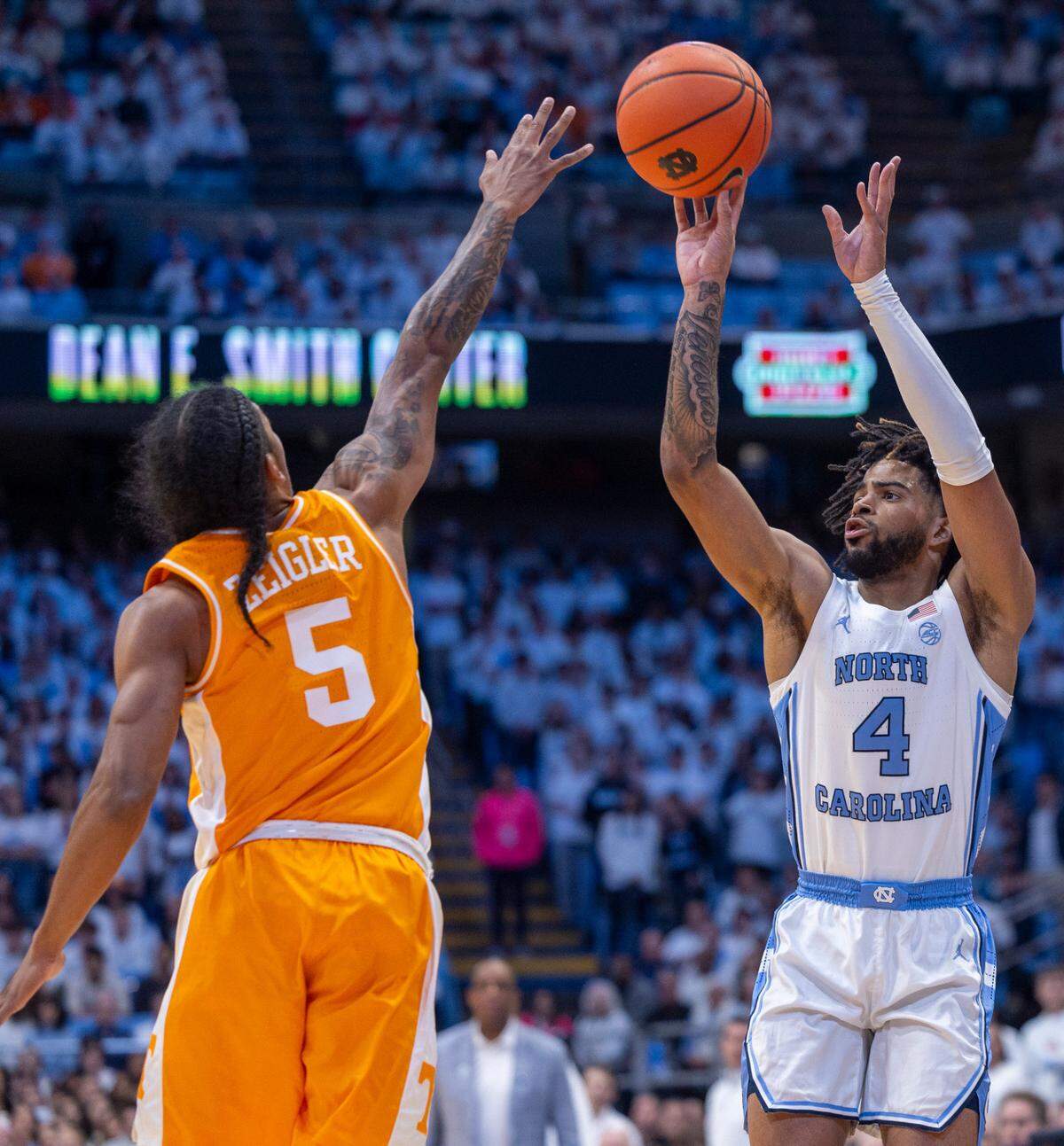 North Carolina’s R.J. Davis (4) shoots over Tennessee’s Zakai Ziegler (5) in the first half on Wednesday, November 29, 2023 at the Smith Center in. Chapel Hill, N.C.