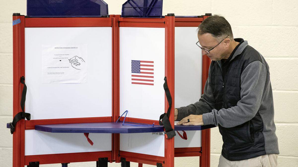 A voter marks his ballot at the Orange Grove Community Center polling place in rural Orange County north of Hillsborough, N.C., Tuesday, Nov. 5 2024.