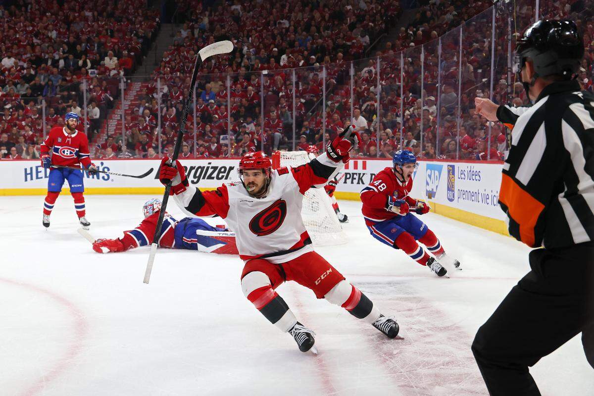 Logan Stankoven #22 of the Carolina Hurricanes celebrates after scoring a goal against the Montreal Canadiens during the first period in Game Four of the Eastern Conference Final of the 2026 Stanley Cup Playoffs at Bell Centre on May 27, 2026 in Montreal, Quebec, Canada. 