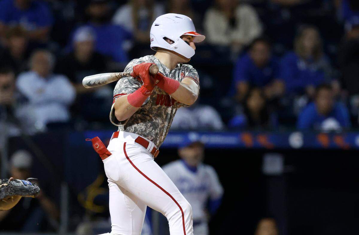 N.C. State’s Cannon Peebles (5) hits a single, scoring Noah Soles in the top of the 11th inning during N.C. State’s 8-7 victory over Duke during the ACC Baseball Championship at the Durham Bulls Athletic Park in Durham, N.C., Tuesday, May 23, 2023.