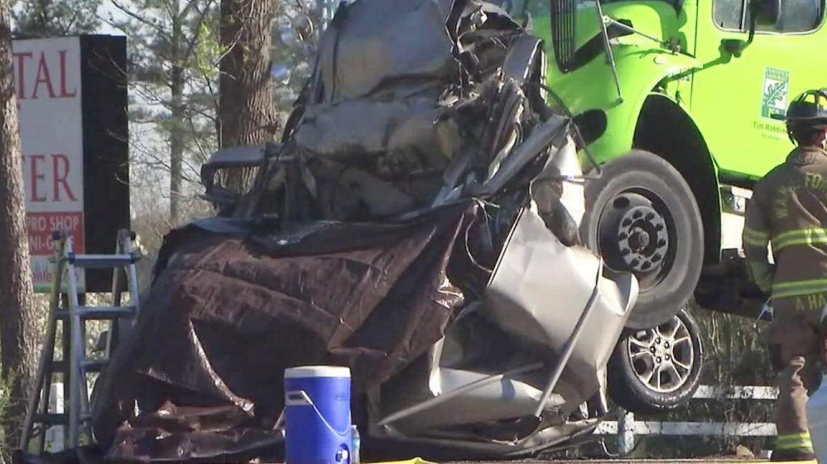 The wreckage of a minivan crushed between two trucks at the scene of an accident on Capital Boulevard near Burlington Mills Road on Tuesday, March 22, 2016 in Wake County. 42-year-old Michelle Simone Barlow of Wake Forest, who was driving the minivan, was killed. Her son has been arrested and charged with trying to hire someone to kill the driver of one of the trucks.