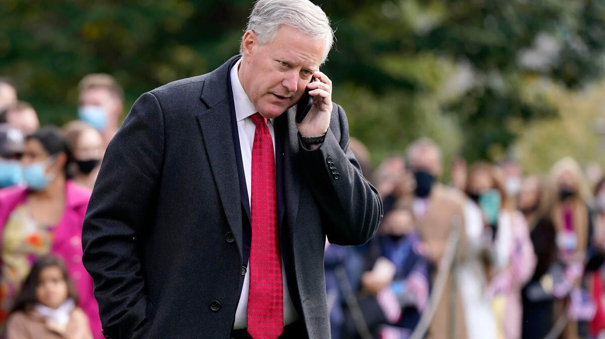 White House Chief of Staff Mark Meadows speaks on a phone on the South Lawn of the White House in Washington, on Oct. 30, 2020.