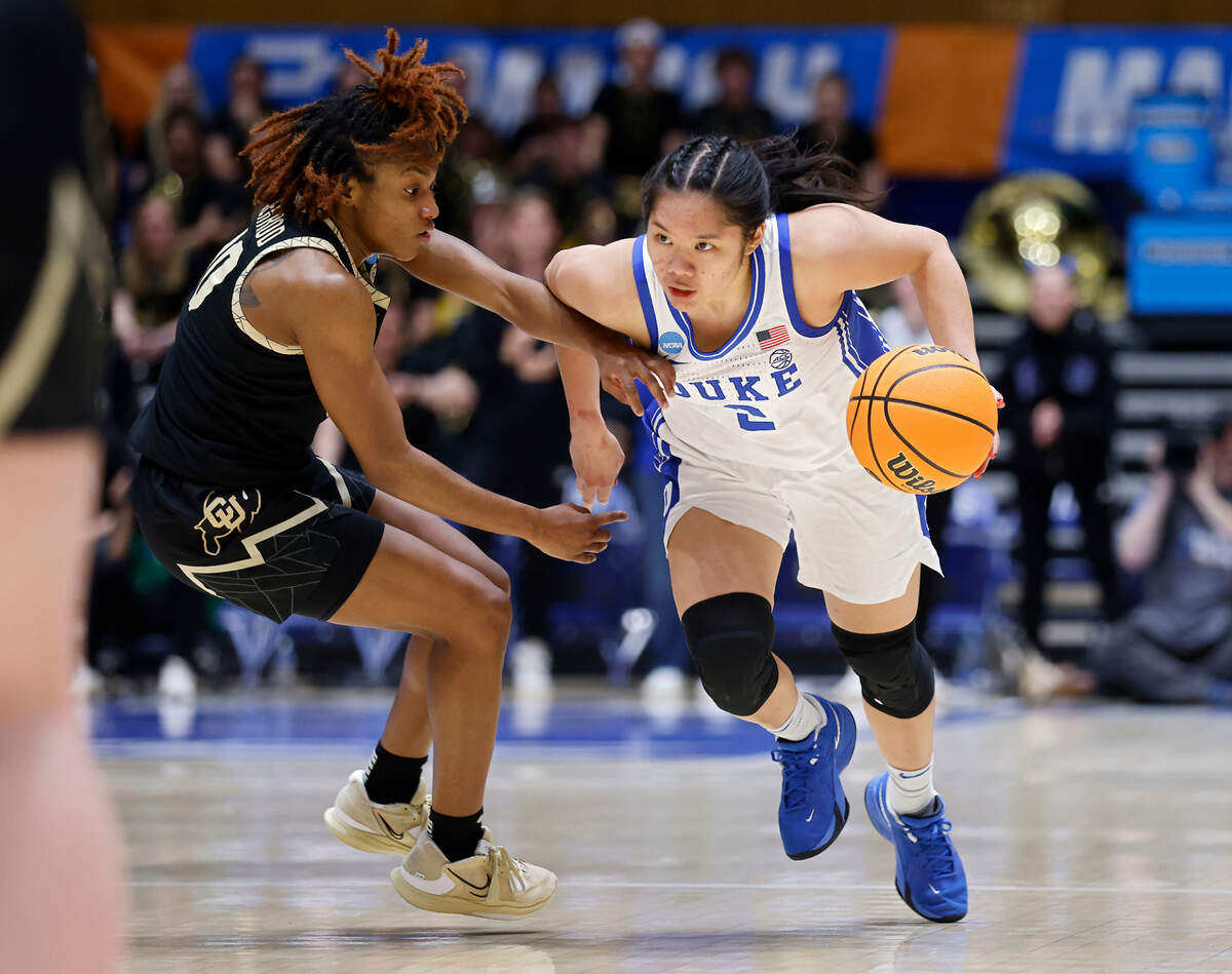 Duke’s Vanessa de Jesus pushes the ball past Colorado’s Jaylyn Sherrod during the second half of the Blue Devils’ 61-53 loss to Colorado in an NCAA Tournament second round game at Cameron Indoor Stadium on Monday, March 20, 2023, in Durham, N.C.