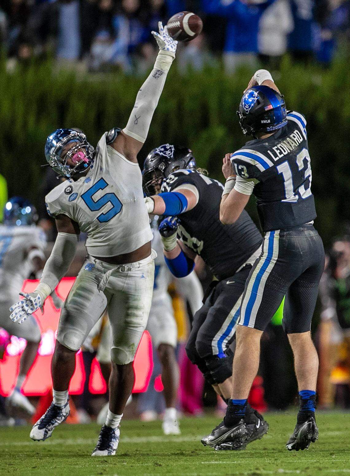 North Carolina’s Travis Shaw (5) defends Duke quarterback Riley Leonard (13) in the fourth quarter on Saturday, October 15, 2022 at Wallace-Wade Stadium in Durham, N.C.