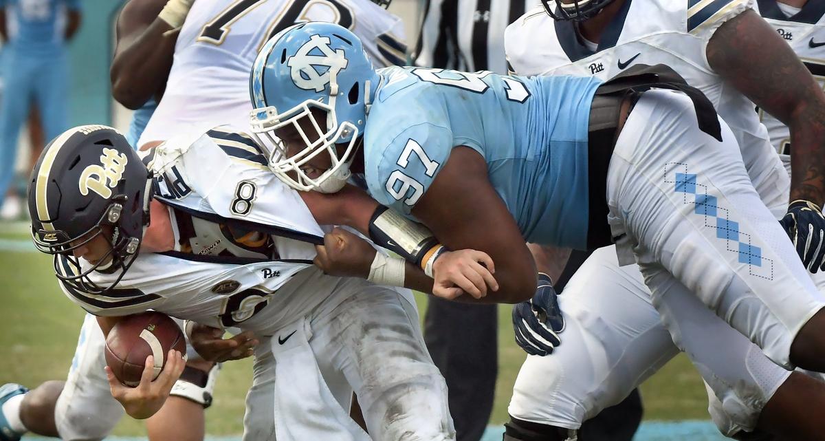 UNC defensive tackle Jalen Dalton (97 sacks Pittsburgh quarterback Kenny Pickett (8) in the fourth quarter. UNC won their first game of the season 38-35 over Pittsburgh in Chapel Hill, N.C. Saturday, Sept.22, 2018.