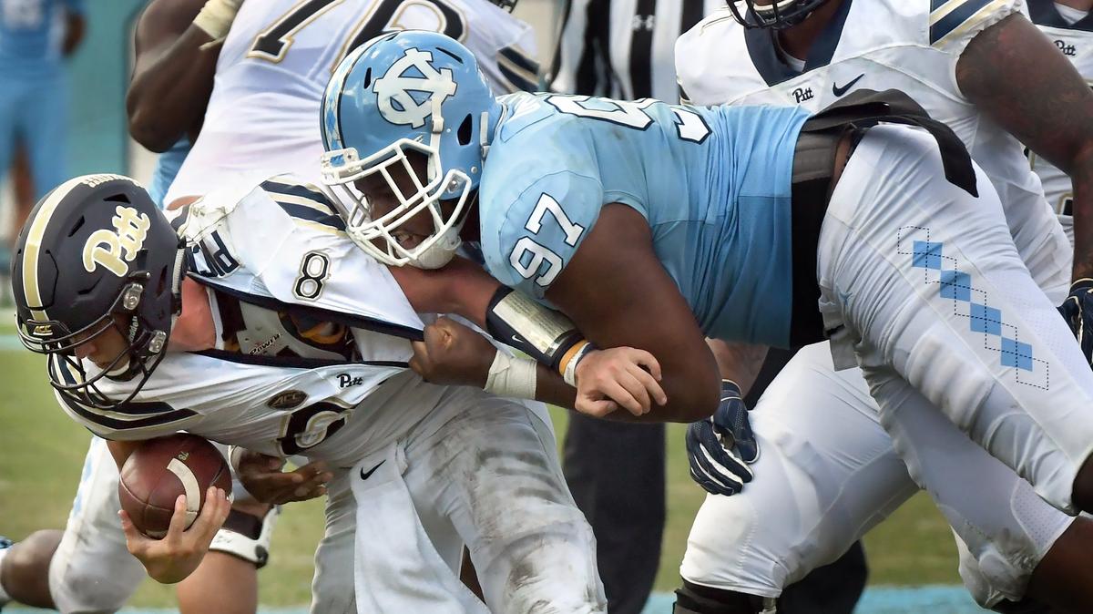 UNC defensive tackle Jalen Dalton (97 sacks Pittsburgh quarterback Kenny Pickett (8) in the fourth quarter. UNC won their first game of the season 38-35 over Pittsburgh in Chapel Hill, N.C. Saturday, Sept.22, 2018.