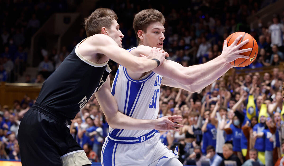 Duke’s Kyle Filipowski (30) drives by Wake Forest’s Andrew Carr (11) during the first half of Duke’s game against Wake Forest at Cameron Indoor Stadium in Durham, N.C., Tuesday, Jan. 31, 2023.