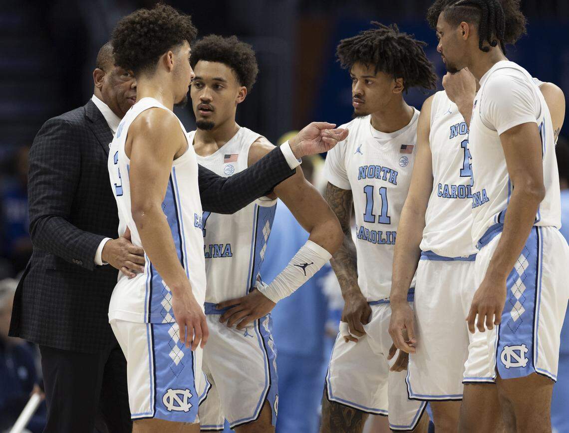 North Carolina coach Hubert Davis huddles with his players in the second half against Clemson on Thursday, March 12, 2026, during the quarterfinals of the ACC Tournament at Spectrum Center in Charlotte, N.C.