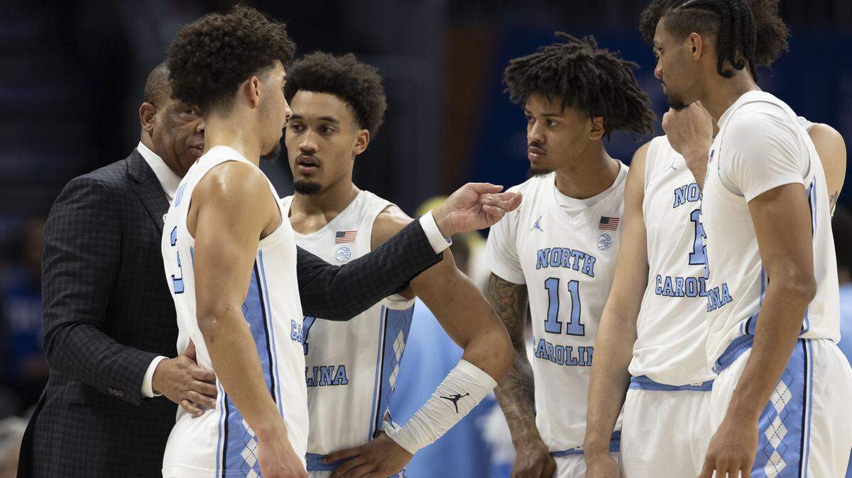 North Carolina coach Hubert Davis huddles with his players in the second half against Clemson on Thursday, March 12, 2026, during the quarterfinals of the ACC Tournament at Spectrum Center in Charlotte, N.C.