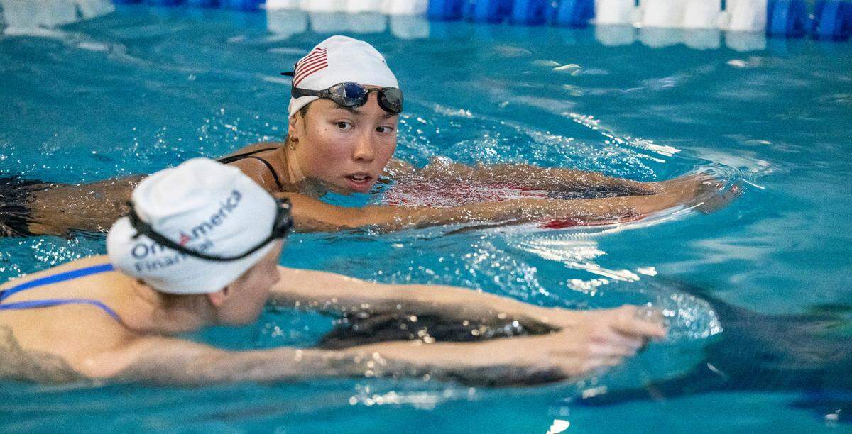 Torri Huske, top, of Arlington, Virginia, an Olympic silver medalist, works out with the 2024 United States Olympic Swim Team on Saturday, July 6, 2024 at the Triangle Aquatic Center in Cary, N.C.