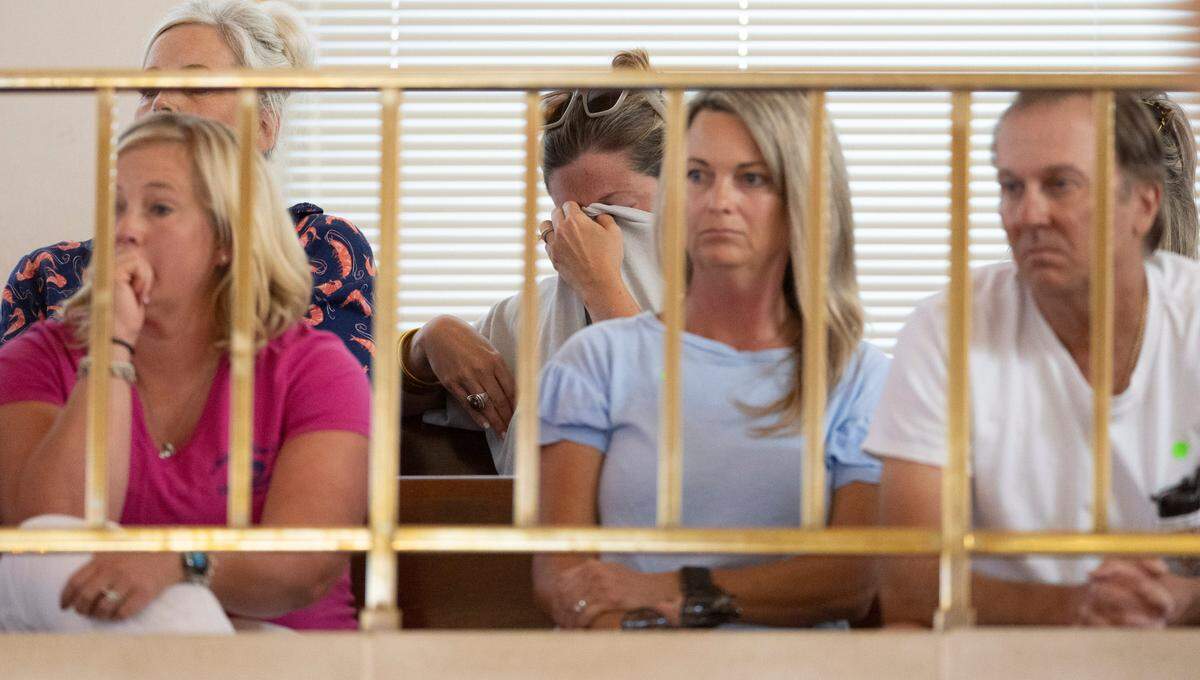 Laken Lewis Wheatly, seated with fishermen in the gallery, covers her face as the North Carolina Senate passes the second reading of HB 442, 40-4 on Wednesday at the N.C. General Assembly.