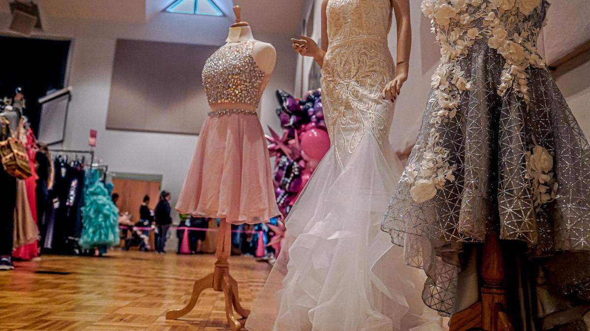 Volunteers at the Prom Shoppe at the Apex United Methodist Church transform the church’s gym into a boutique with dressing rooms to give girls the full experience of shopping for their prom dresses.