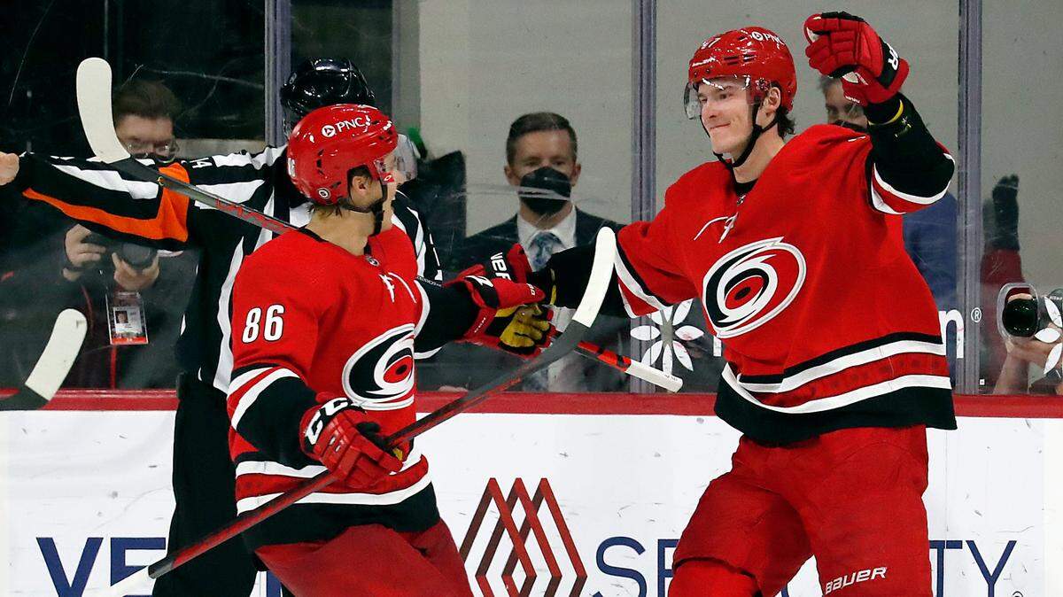 Carolina Hurricanes’ Andrei Svechnikov (37) celebrates his goal with teammate Teuvo Teravainen (86) during the third period of an NHL hockey game against the Chicago Blackhawks in Raleigh, N.C., Tuesday, May 4, 2021. (AP Photo/Karl B DeBlaker)