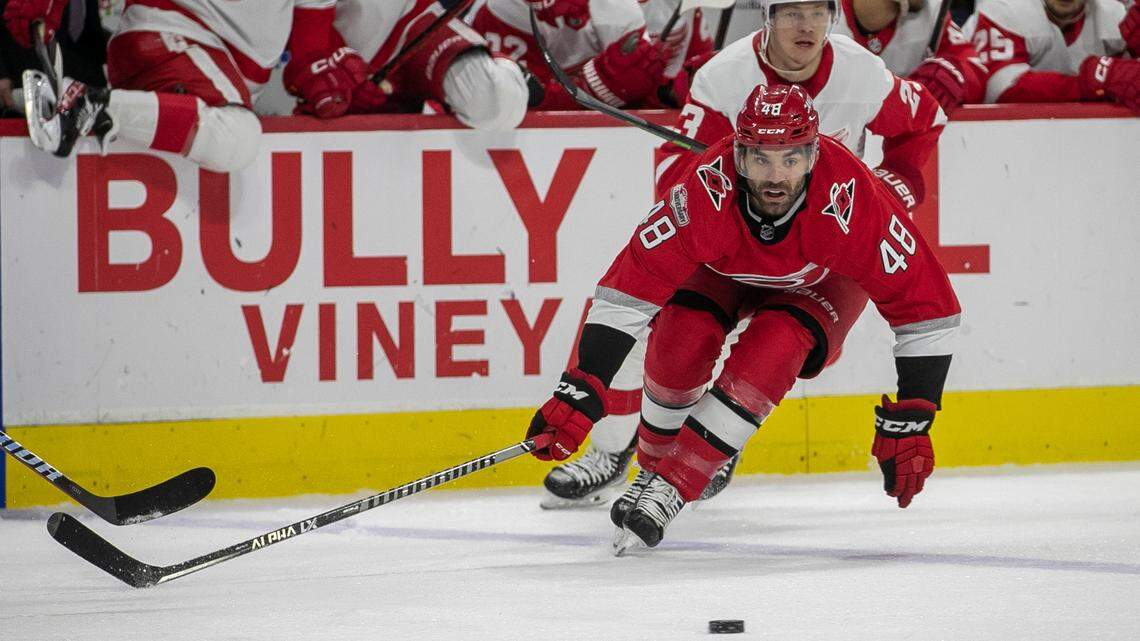 Carolina Hurricanes’ Jordan Martinook (48) goes after the puck ahead of Detroit’s Lucas Raymond (23) in the first period on Tuesday, April 11, 2023 at PNC Arena in Raleigh, N.C.