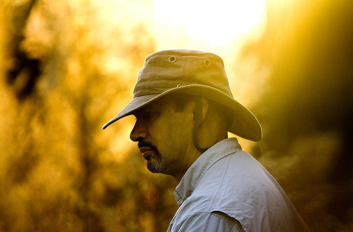 In this December 2009 file photo, Phil Freelon stands silently on the bank of a friend’s pond and fishes for bass. Although he came up empty handed for his 2-hour outing, he says it’s not about catching fish but about enjoying the peace and quiet. “I’m not thinking about the office when I’m out here,” he says. “I’m not thinking about anything at all.”