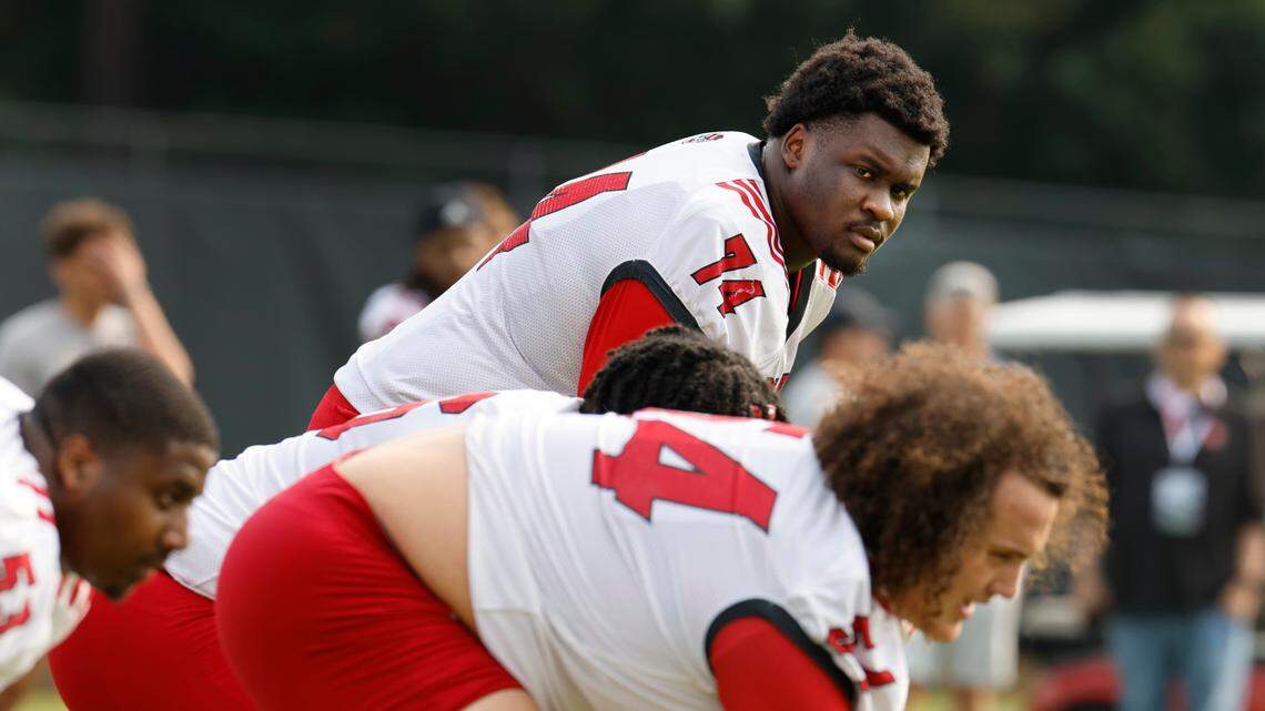 The N.C. State’s Anthony Belton (74) and the offensive line prepare to run a drill during the Wolfpack’s first fall practice in Raleigh, N.C., Wednesday, August 2, 2023.